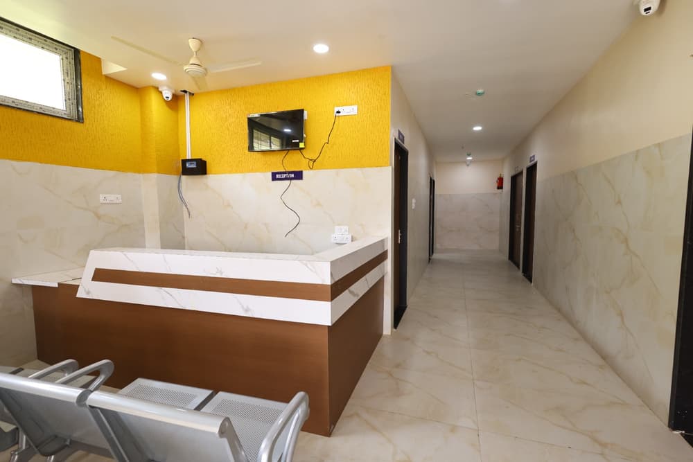The reception desk at New Sri Sangameshwar Scanning Centre, with the corridor to the scan rooms behind it